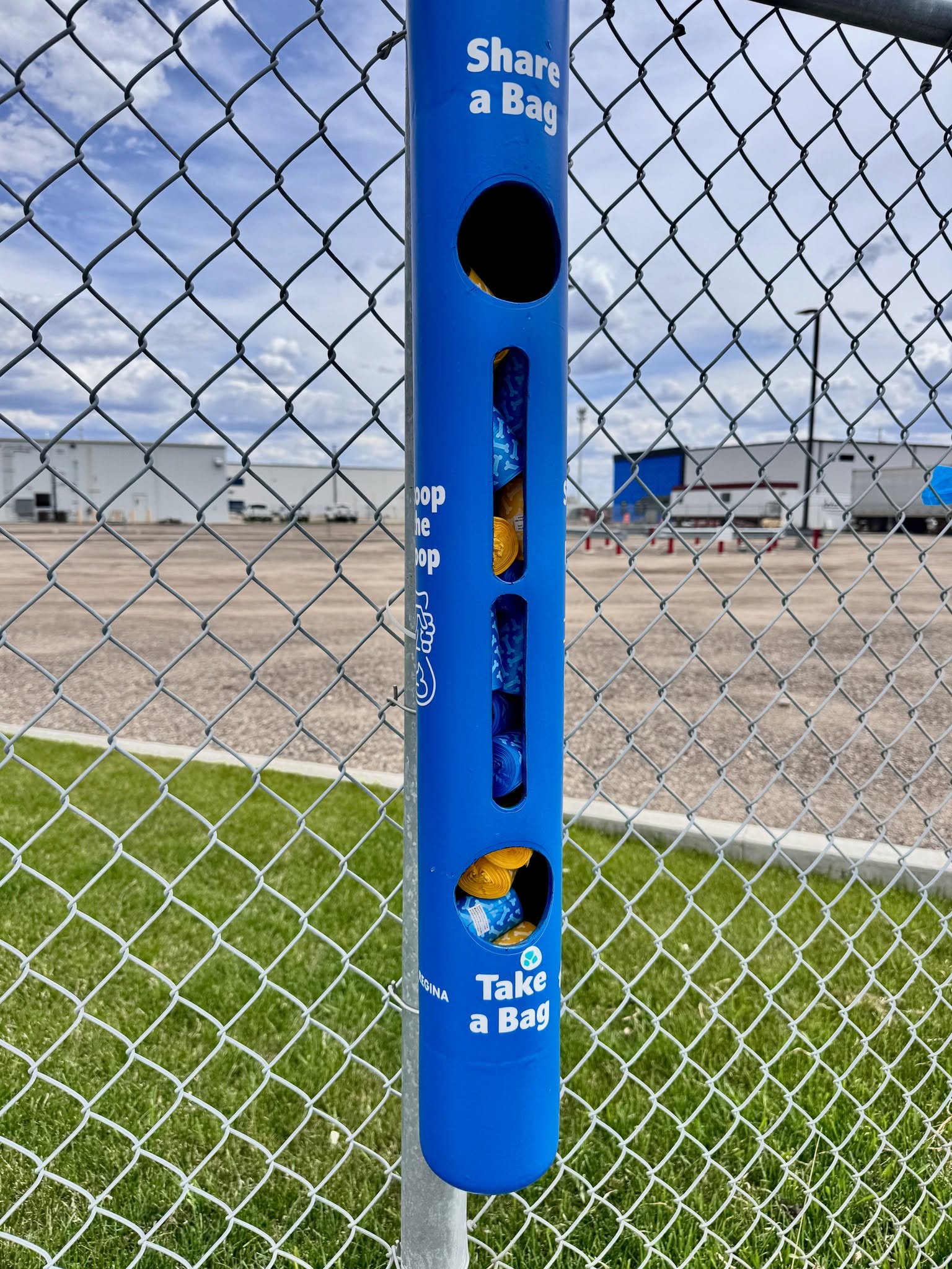 A Share a Bag and Take a Bag dispenser at a Regina dog park