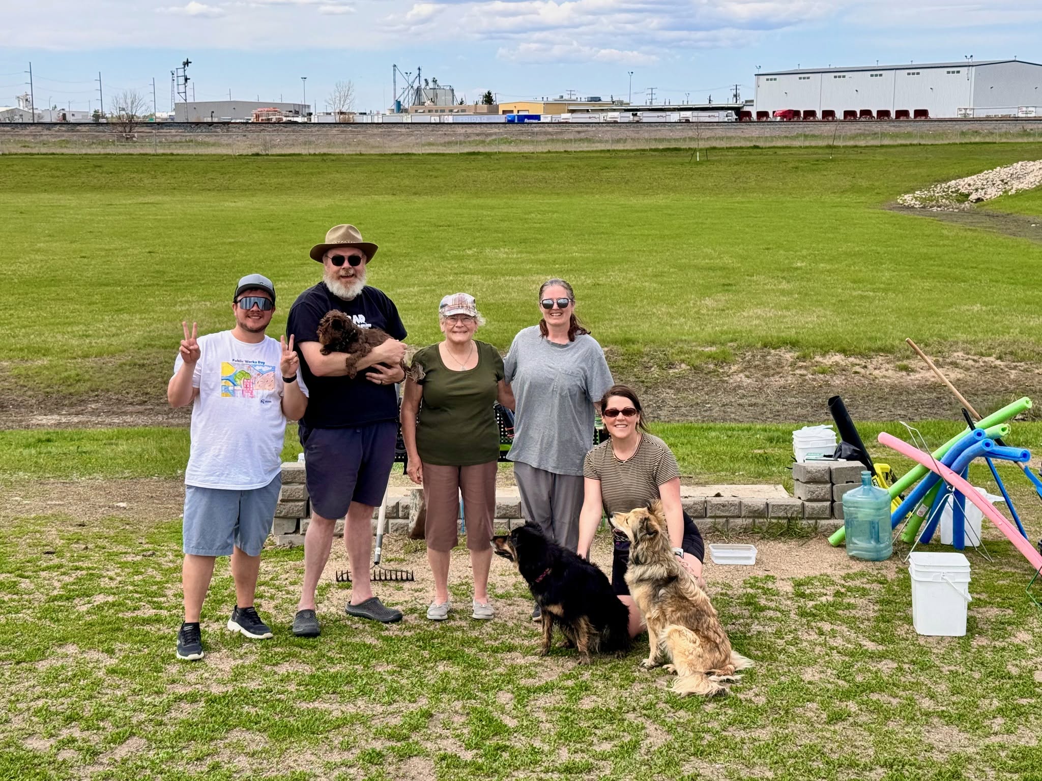 Dog park users and volunteers taking part in a Regina park cleanup